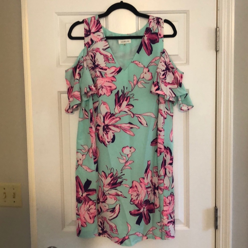 Floral dress with shoulder cutouts.